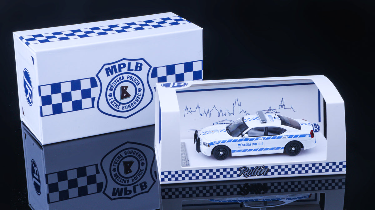 JR Collectibles x Rollin – Městská Policie Lázně Bohdaneč “Adam” 1:64 scale police car with blue-and-white livery.