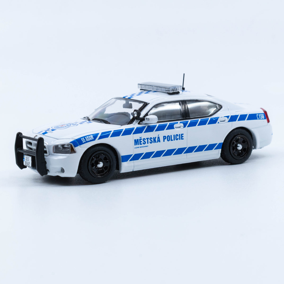 JR Collectibles x Rollin – Městská Policie Lázně Bohdaneč “Adam” 1:64 scale police car with blue-and-white livery.