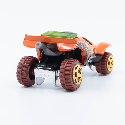 Hot Wheels Da’Kar off-road die-cast vehicle with raised suspension, rally graphics, and all-terrain tires. Back