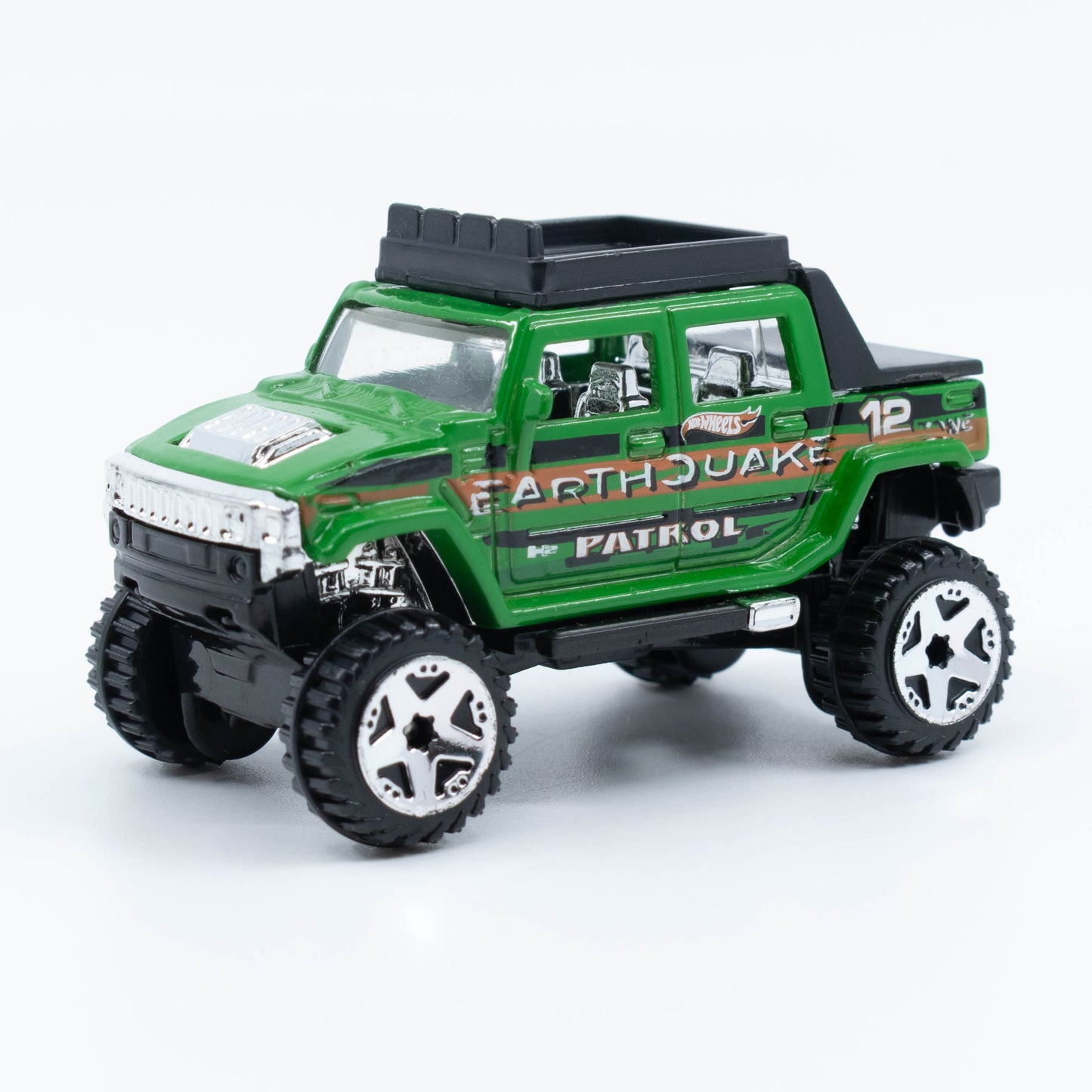 Hot Wheels Hummer H2 SUT diecast model in 1:64 scale with lifted suspension and off-road styling. Front