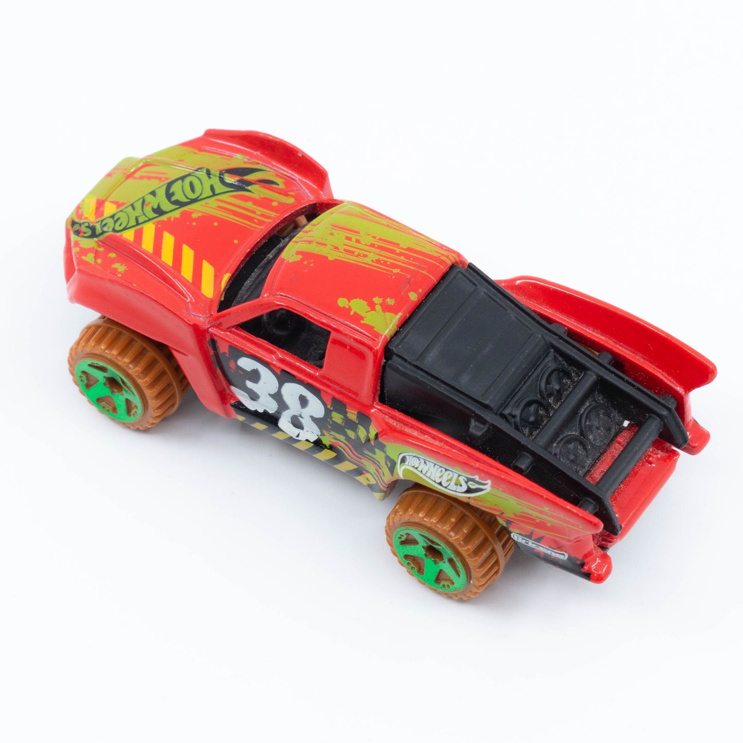 Hot Wheels Baja Truck in 1:64 scale with lifted suspension, roof rack, and off-road racing graphics. Top