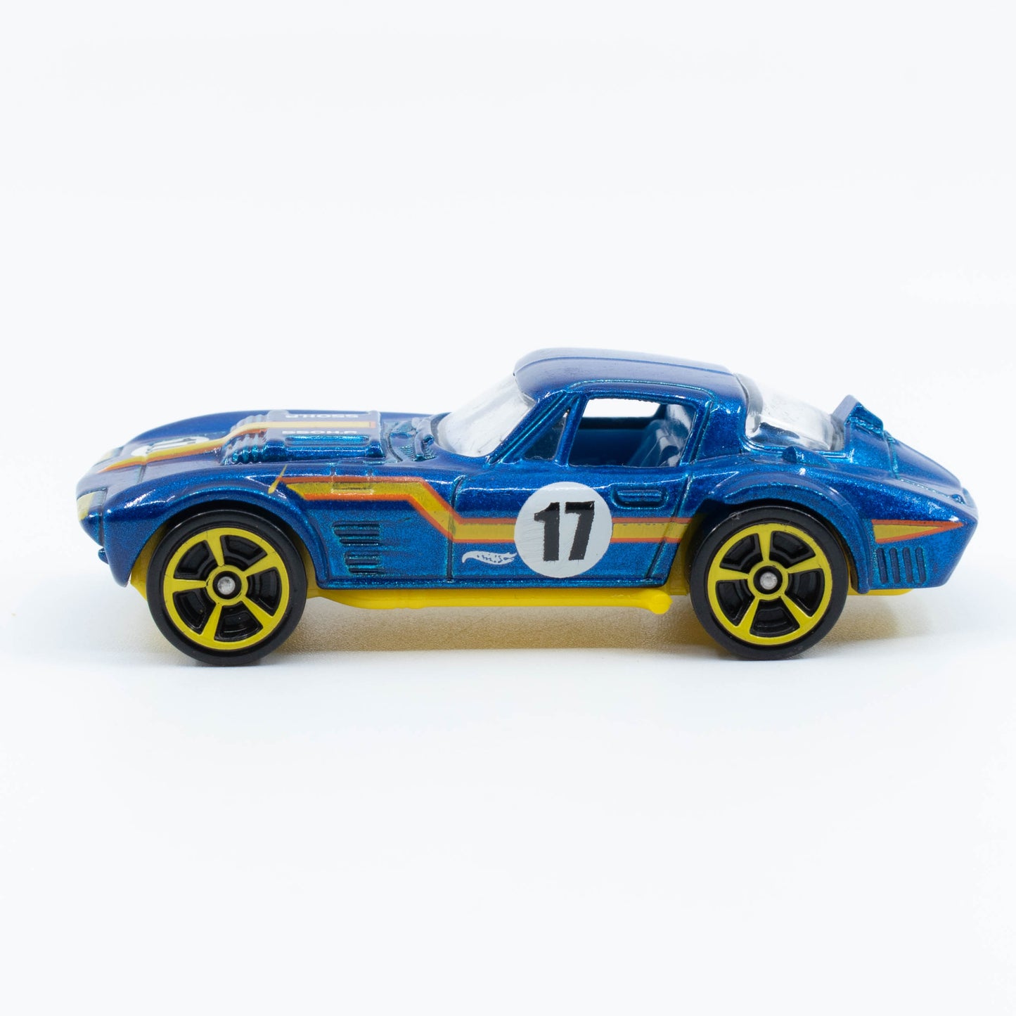 Hot Wheels Corvette Grand Sport diecast with flared fenders and classic race styling in 1:64 scale. Side