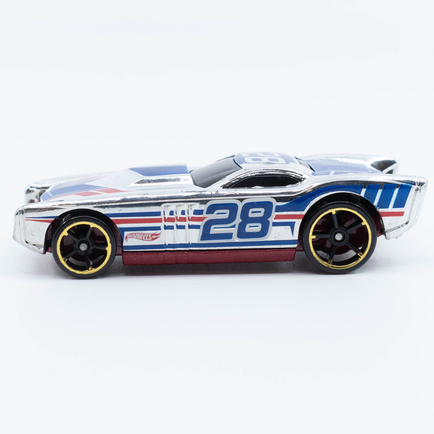 Hot Wheels The Gov’ner 1:64 scale diecast car with low-profile body and sporty chrome detailing. Side