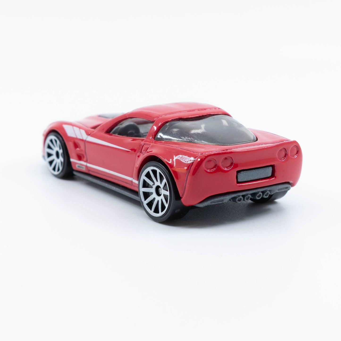 Hot Wheels diecast of the 2009 Corvette ZR1 with detailed body and clear hood showcasing engine. Back