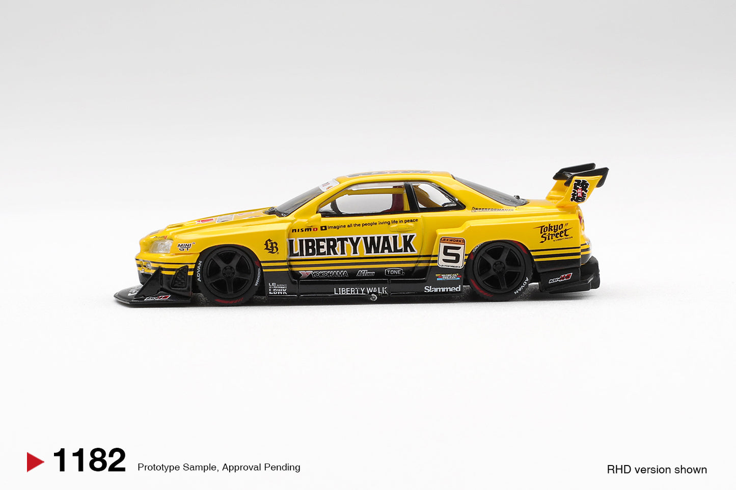 Mini GT 1:64 Nissan Skyline R34 Super Silhouette Sport Yellow 2025 diecast model. Side