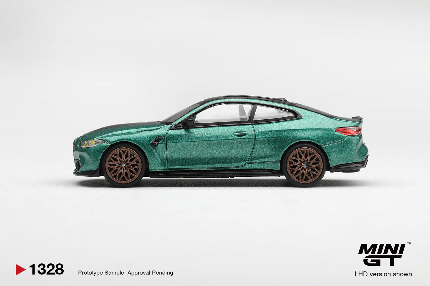 Mini GT BMW M4 CS G82 in Frozen Isle of Man Green Metallic. Side