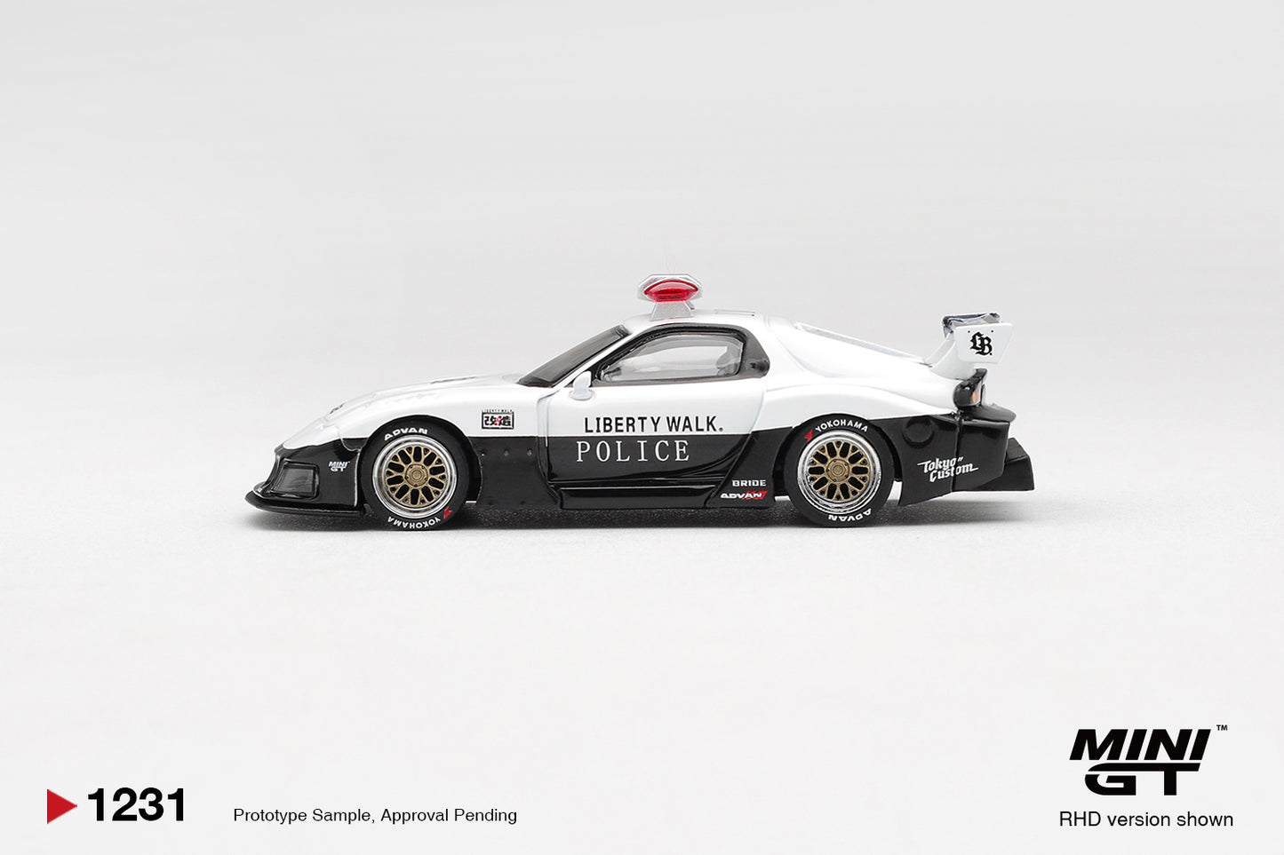 Mini GT Mazda RX7 LB Super Silhouette Police 1998 1:64 diecast model. Side