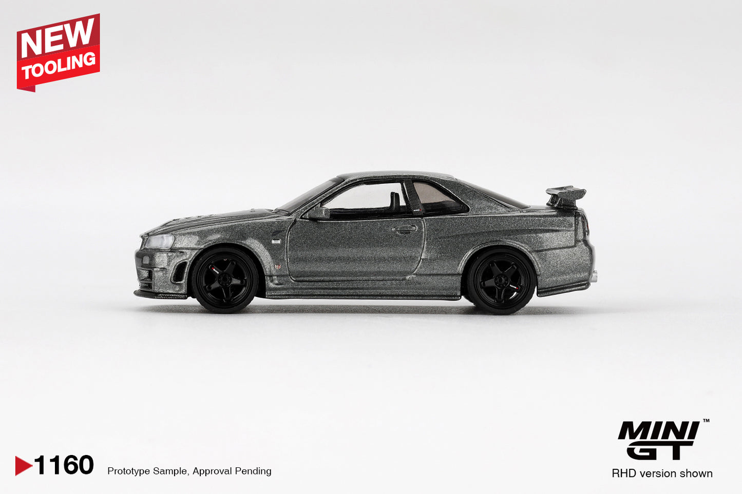1:64 Mini GT Nissan Skyline GT-R (R34) Nismo CRS 1999 – Dark Metal Gray JDM die-cast model. Side