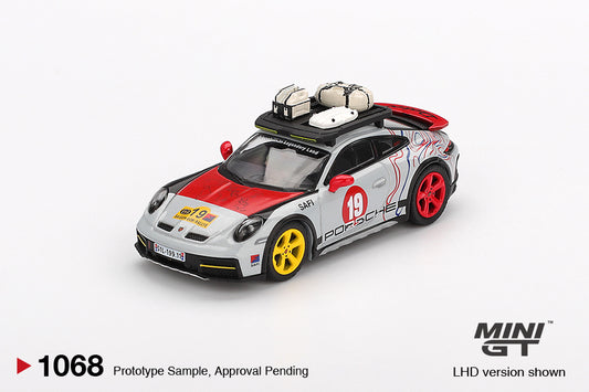 Mini GT Porsche 911 (992) Dakar Uncle Rally 2024 in 1:64 scale, featuring off-road livery and lifted suspension. Front