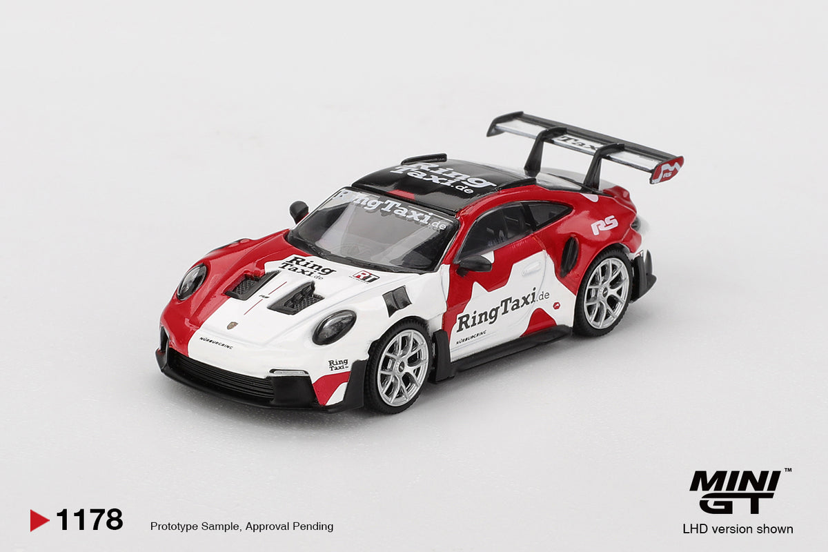 Mini GT 1:64 Porsche 911 (992) GT3 RS Weissach Ring Taxi 2025 track-focused model. Front