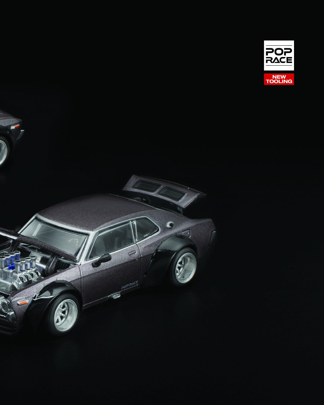 POP Race 1:64 Nissan Laurel C130 diecast in metallic grey with retro styling and chrome accents. Right