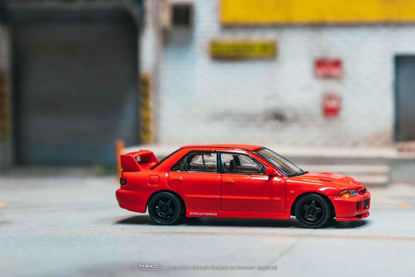 Tarmac Works Global64 Mitsubishi Lancer GSR Evolution III in red.