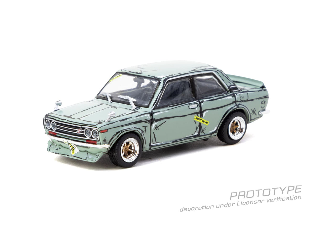 Tarmac Works 1973 Datsun 510 Bluebird Wagon SSS in green, a 1:64 Hobby64 diecast model in an acrylic display case.