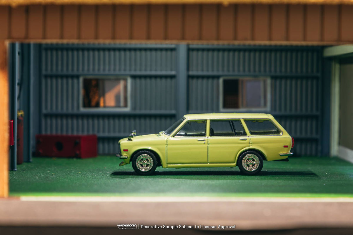 Tarmac Works 1:64 Datsun 510 Bluebird Wagon 1973 yellow diecast model. Side
