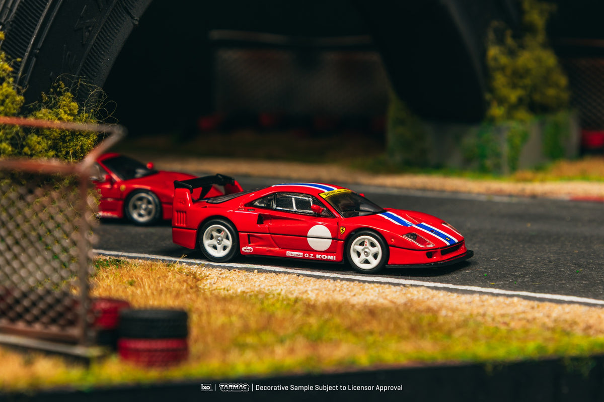 Tarmac Works 1:64 Ferrari F40 LM Rosso Corsa race version with stripe detail model in acrylic display case. Side