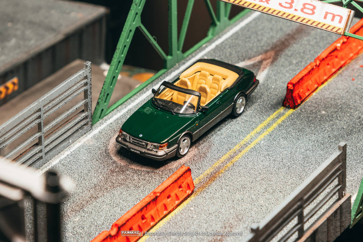 Tarmac Works 1:64 Saab 900 Turbo Cabriolet 1997 dark green diecast model. Front