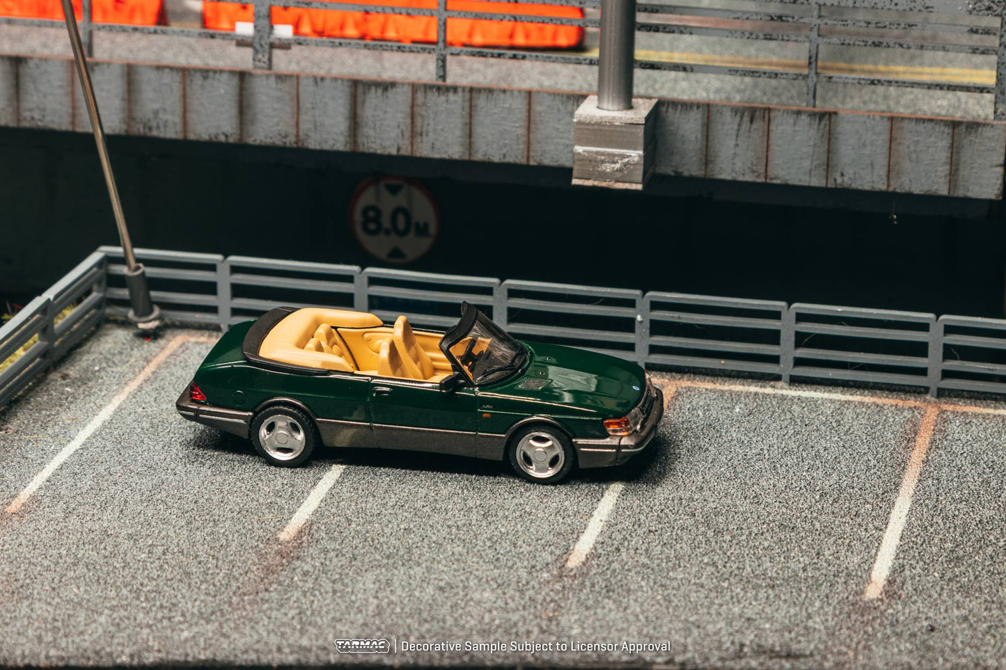 Tarmac Works 1:64 Saab 900 Turbo Cabriolet 1997 dark green diecast model. Side