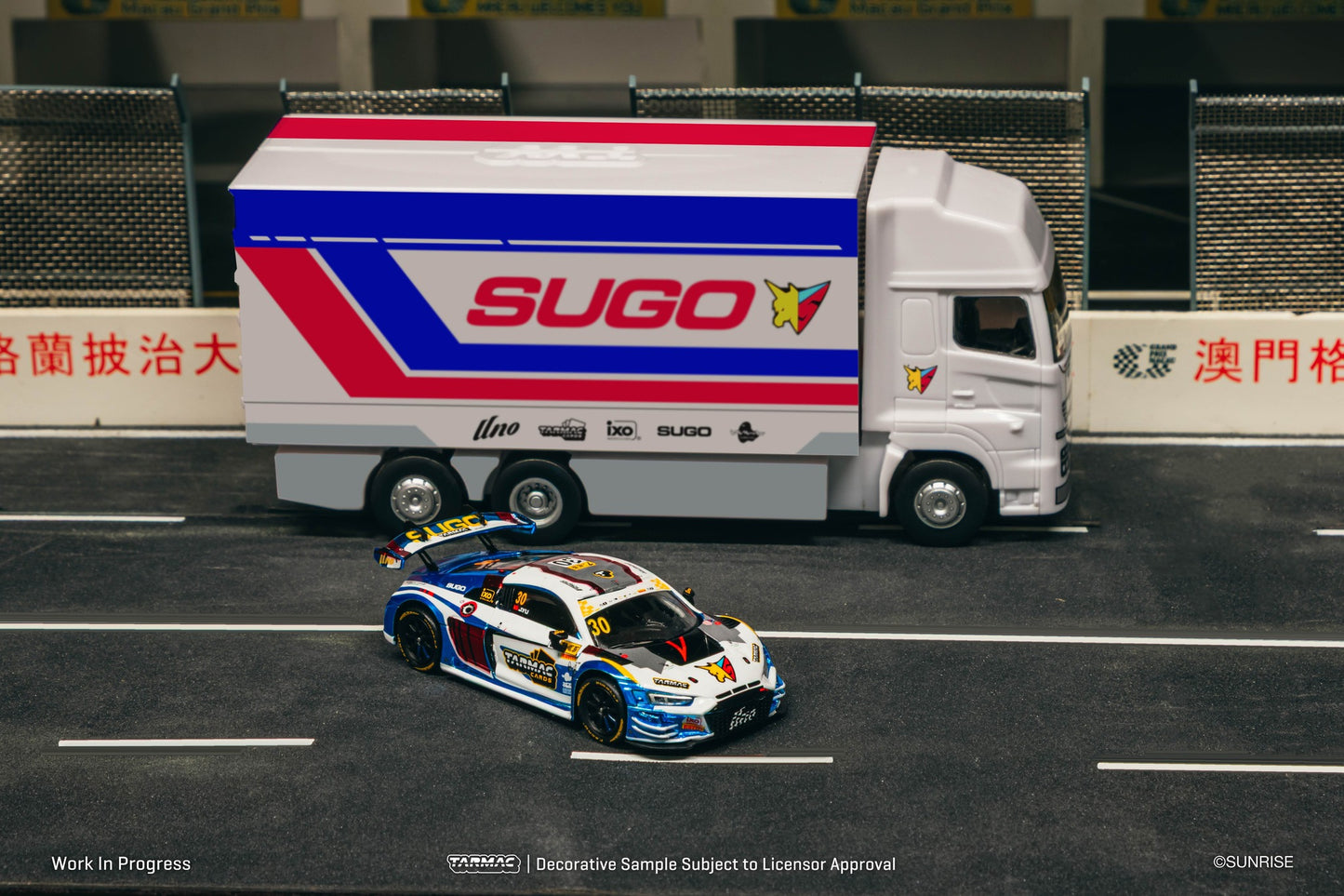 1:64 Tarmac Works Audi R8 LMS GT3 evo II James Yu 2024 Macau GT Cup in Uno Racing livery with trading cards and truck packaging. Front