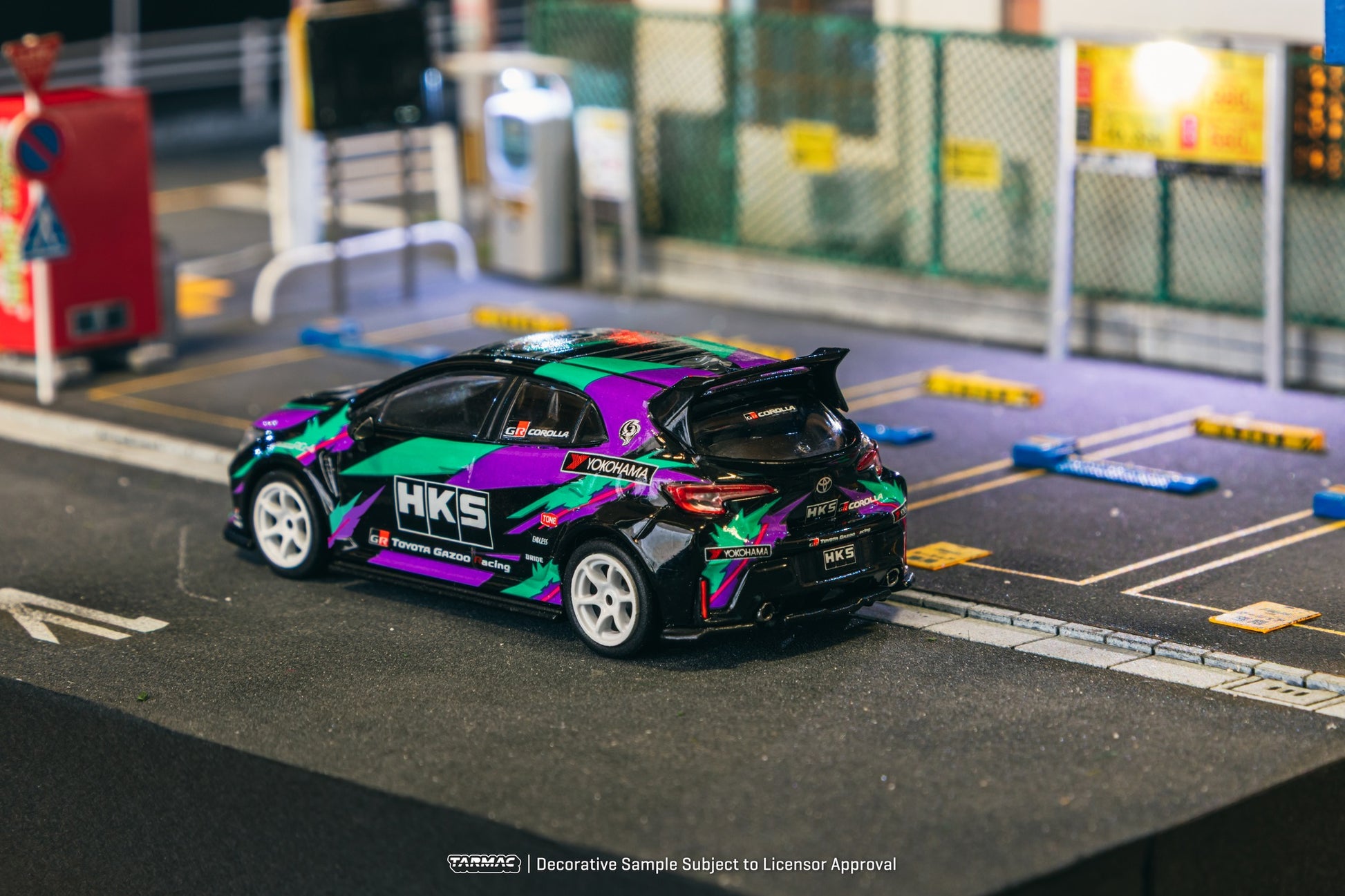 1:64 scale Tarmac Works HKS Toyota GR Corolla with iconic oil splash livery and widebody styling.