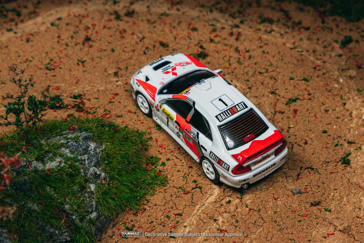Tarmac Works Mitsubishi Lancer Evolution IV #1 Monte Carlo Rally 1997 diecast car in red WRC livery. Top