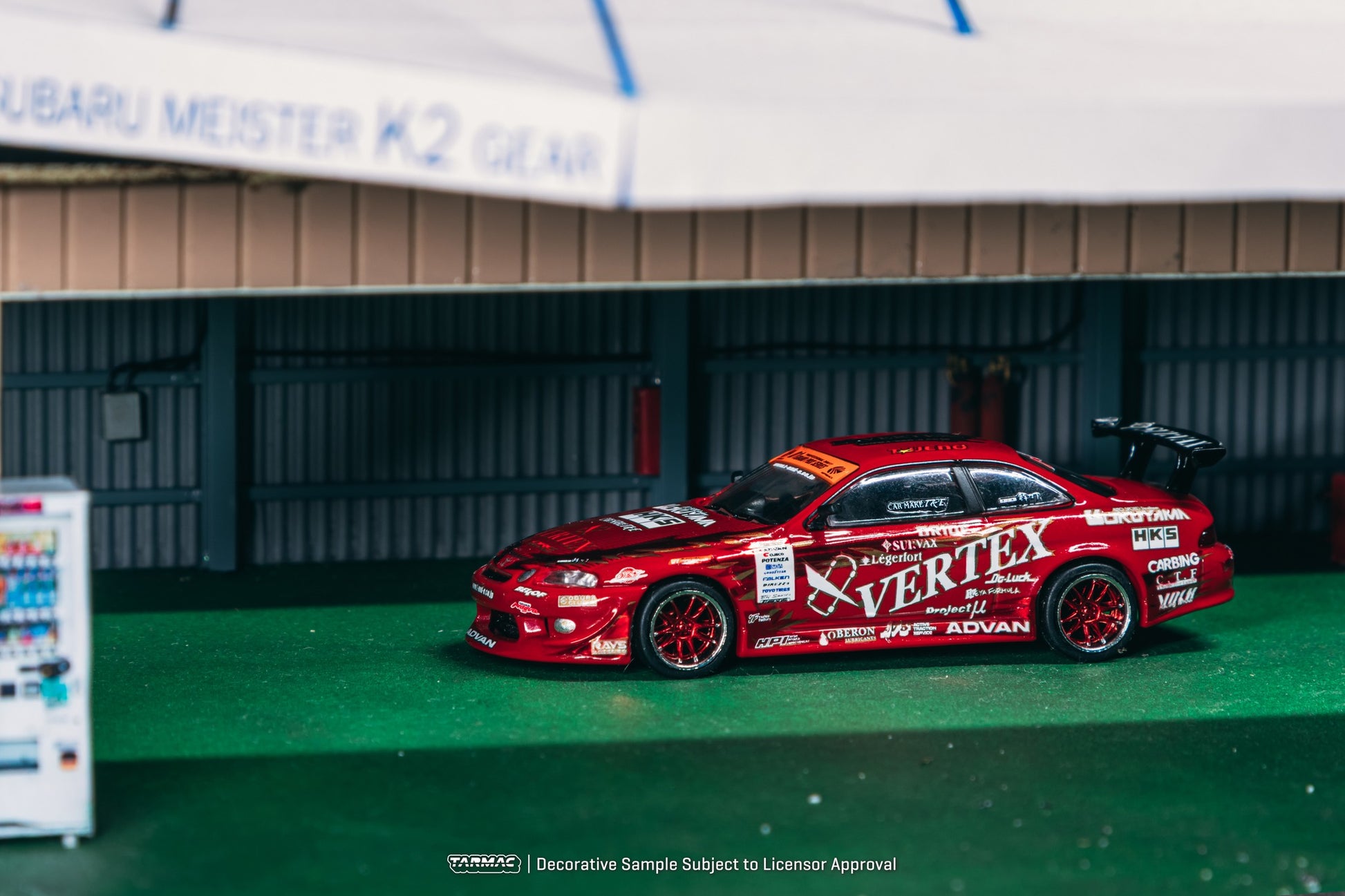 1:64 Tarmac Works Vertex Ridge TE3005 Soarer in red, widebody kit, detailed wheels and lights, part of a Combo Set with collectible trading cards. Side