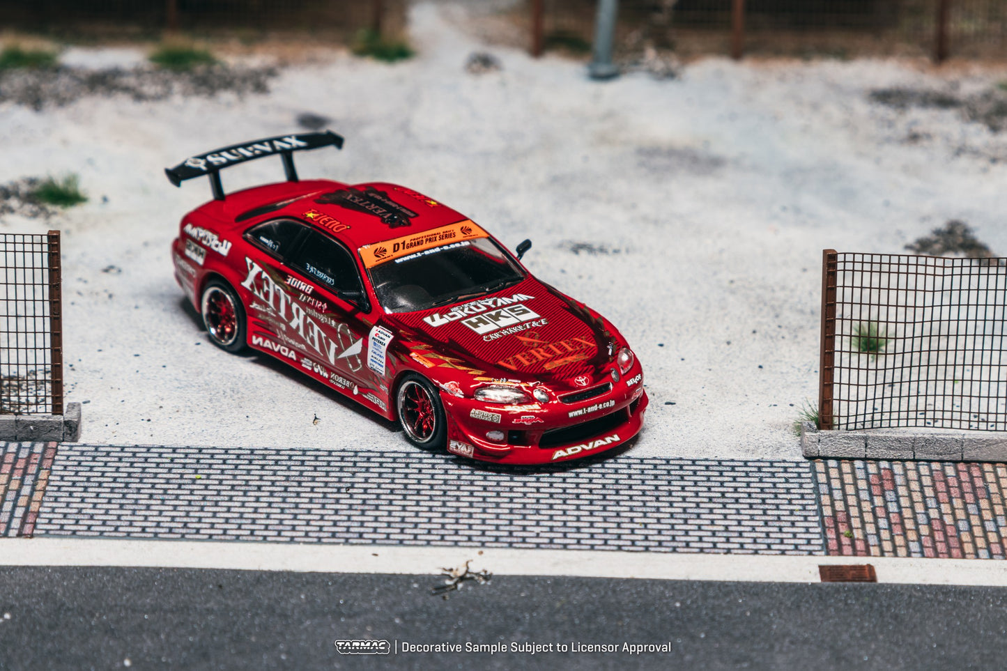 1:64 Tarmac Works Vertex Ridge TE3005 Soarer in red, widebody kit, detailed wheels and lights, part of a Combo Set with collectible trading cards. Front