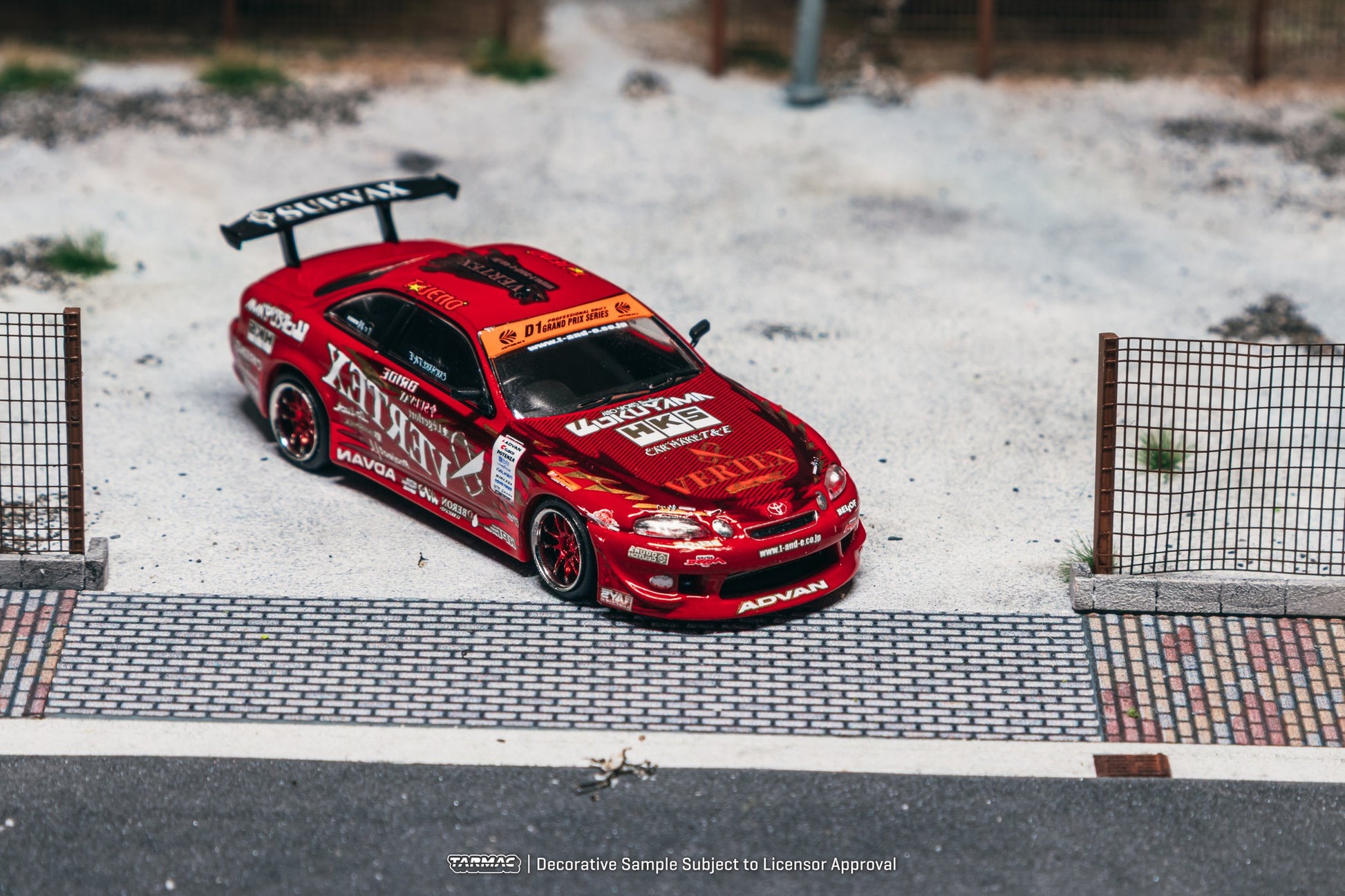 1:64 Tarmac Works Vertex Ridge TE3005 Soarer in red, widebody kit, detailed wheels and lights, part of a Combo Set with collectible trading cards. Front