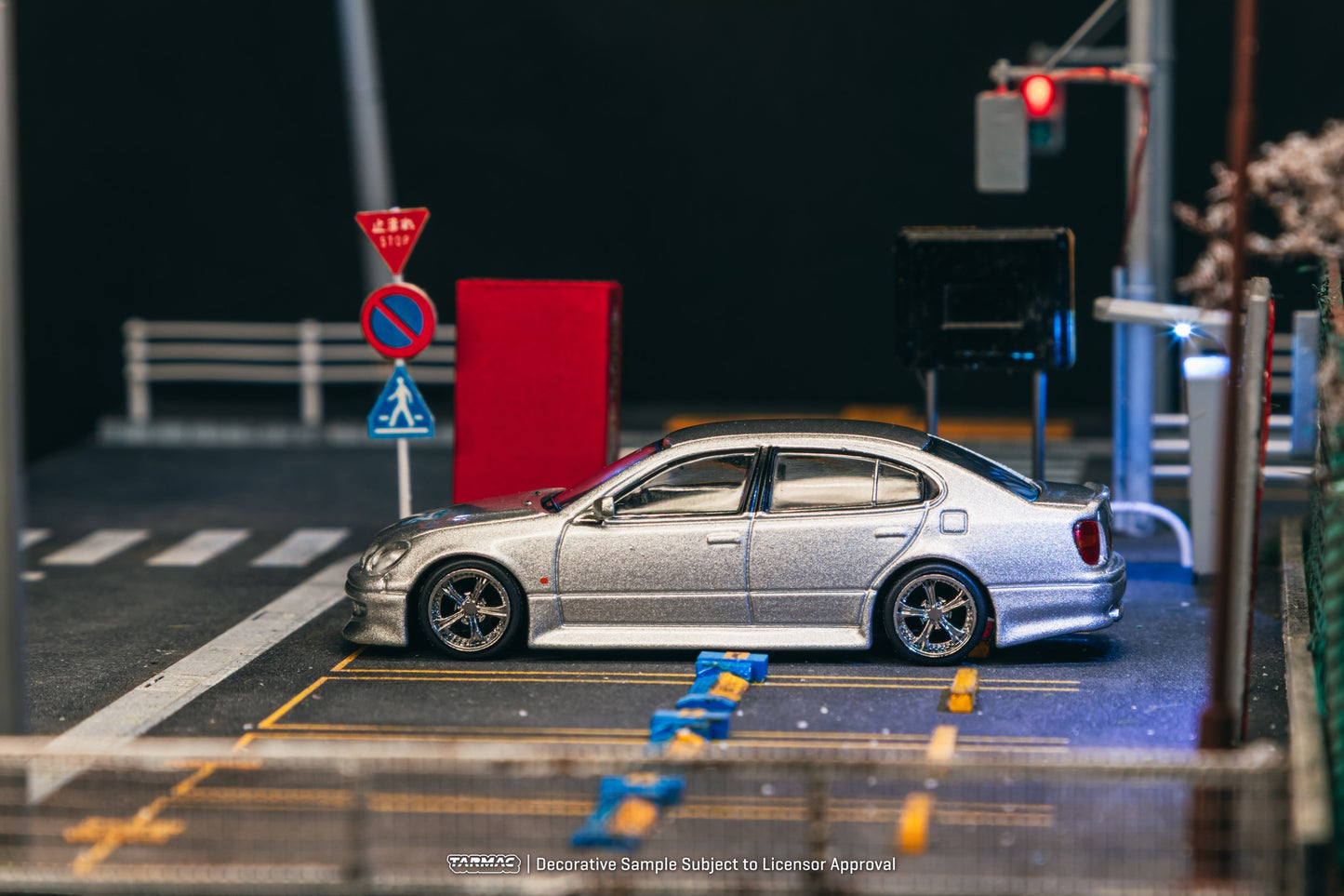 1:64 scale Tarmac Works Vertex Toyota Aristo JZS161, new tooling featuring Vertex aero kit, detailed headlights, wheels, and authentic VIP-style stance. Side