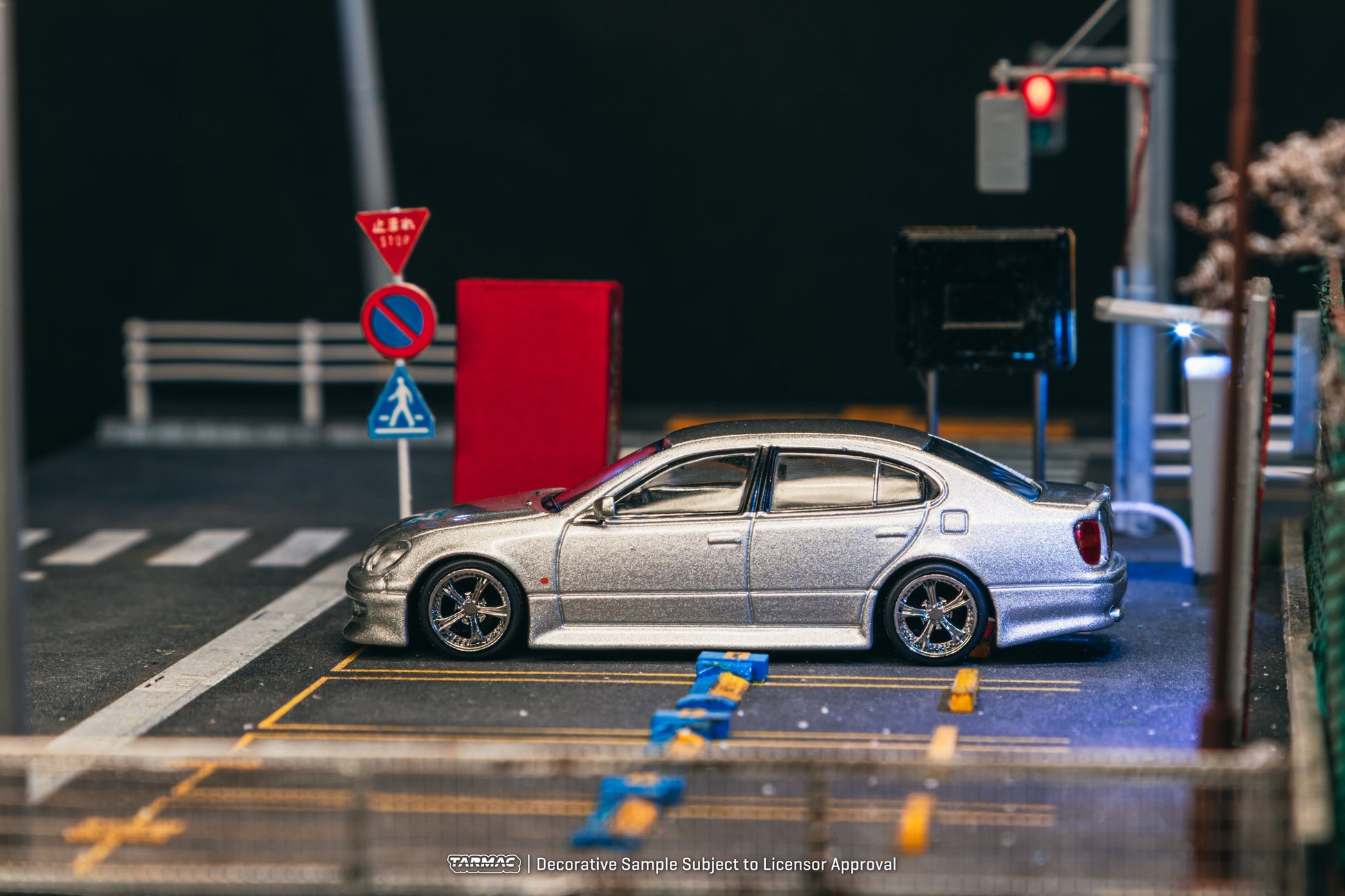 1:64 scale Tarmac Works Vertex Toyota Aristo JZS161, new tooling featuring Vertex aero kit, detailed headlights, wheels, and authentic VIP-style stance. Side
