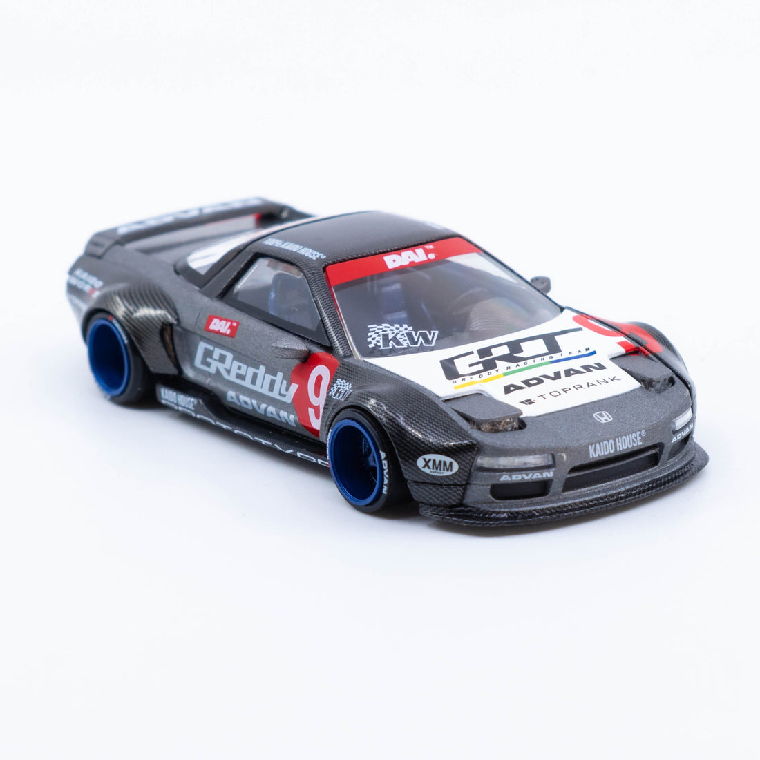 Kaido★House Honda NSX Test Car Spec V1 in grey with blue deep-dish wheels, wide-body kit, pop-up headlights, opening engine hatch and prototype racing livery in 1:64 scale