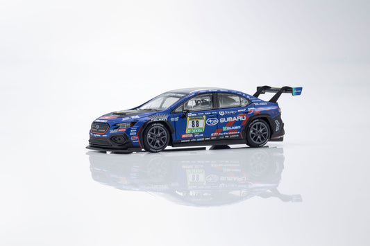Kyosho 1:64 Subaru WRX STI NBR 2024 MOTN model with activated headlights and taillights.