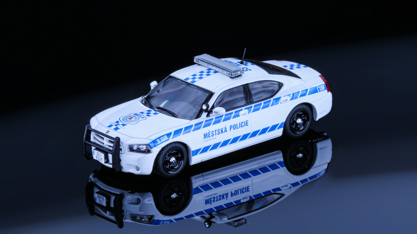 JR Collectibles x Rollin – Městská Policie Lázně Bohdaneč “Adam” 1:64 scale police car with blue-and-white livery.