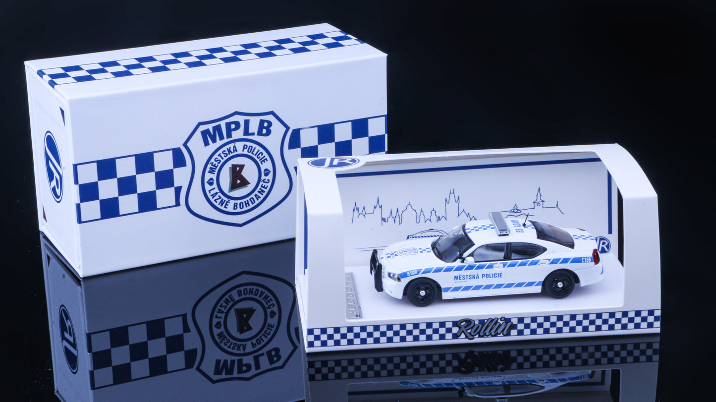JR Collectibles x Rollin – Městská Policie Lázně Bohdaneč “Adam” 1:64 scale police car with blue-and-white livery.