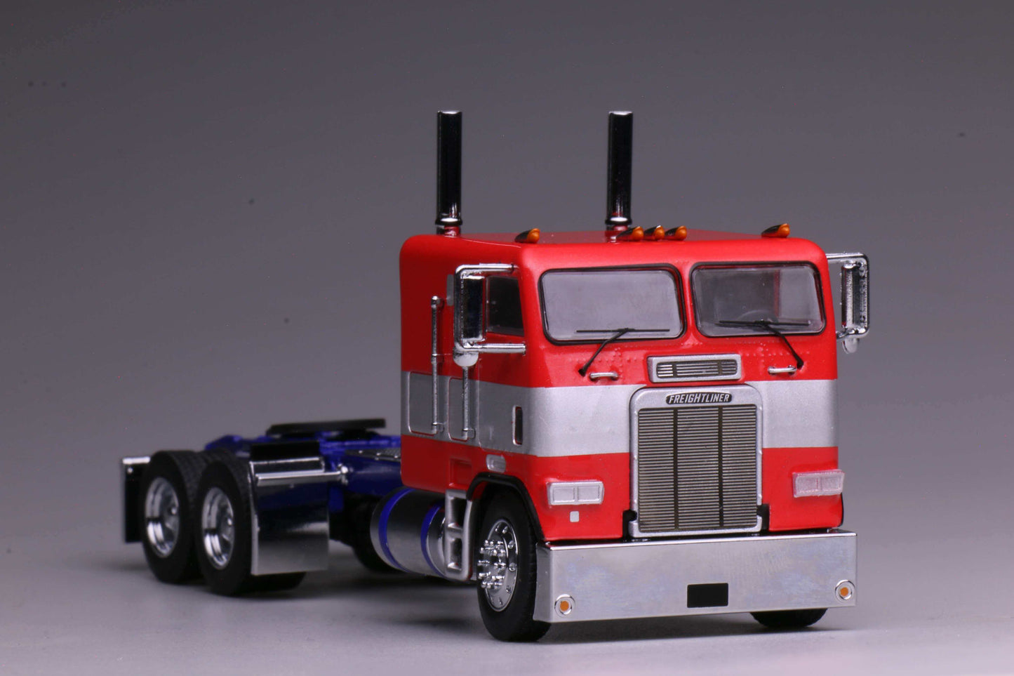 596 1980 Freightliner FL86 Optimus Prime from Transformers Generation 1, HEC 2026 Exclusive 1:64 model with opening cabin and detailed engine.