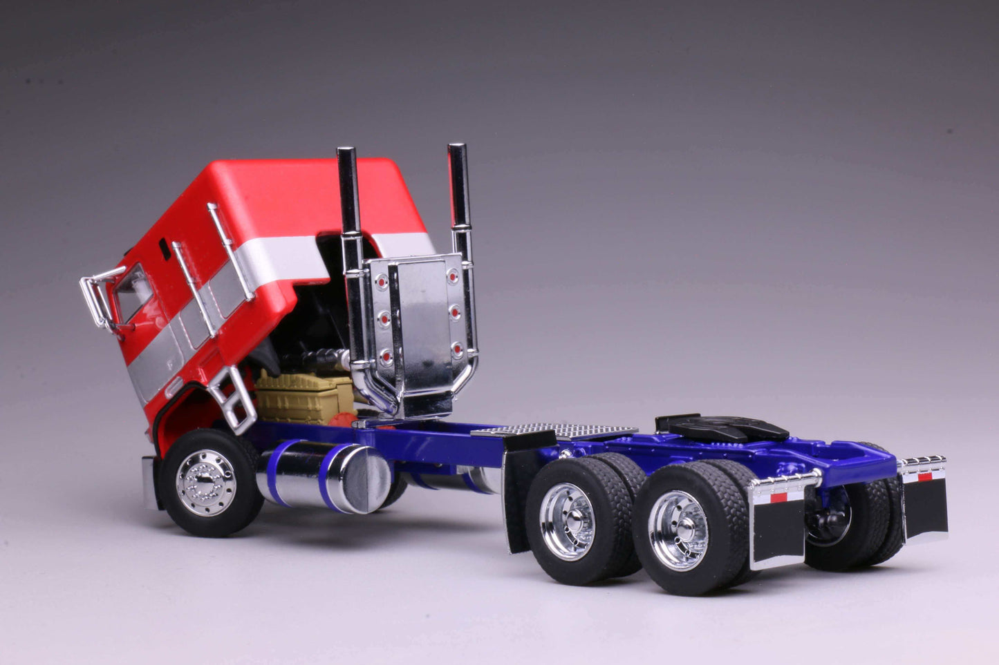 596 1980 Freightliner FL86 Optimus Prime from Transformers Generation 1, HEC 2026 Exclusive 1:64 model with opening cabin and detailed engine.
