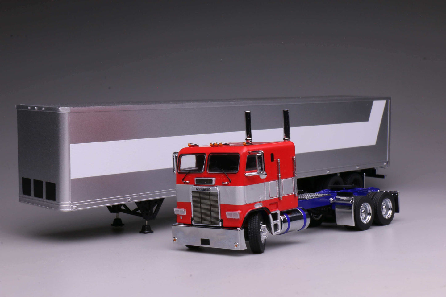 596 1980 Freightliner FL86 Optimus Prime from Transformers Generation 1, HEC 2026 Exclusive 1:64 model with opening cabin and detailed engine.