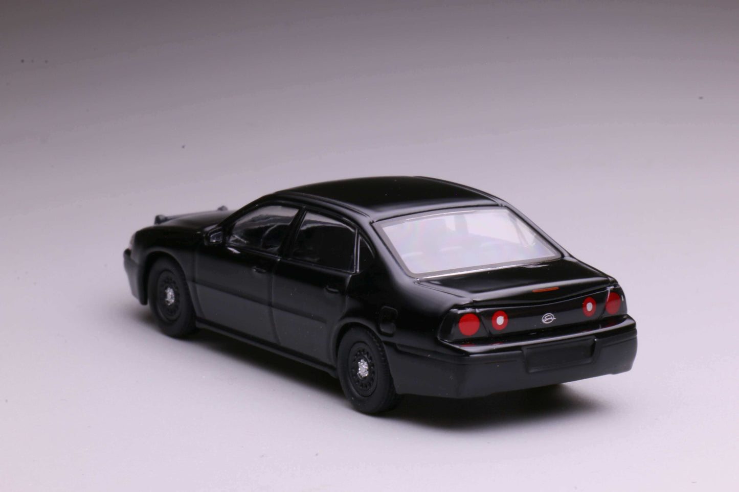 596 Models 2001 Chevrolet Impala 9C3 Undercover Police Package in matte black with front bull bar.