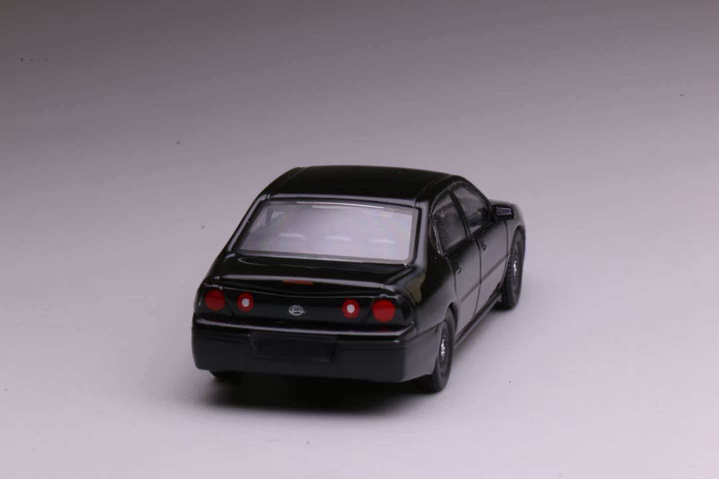 596 Models 2001 Chevrolet Impala 9C3 Undercover Police Package in matte black with front bull bar.