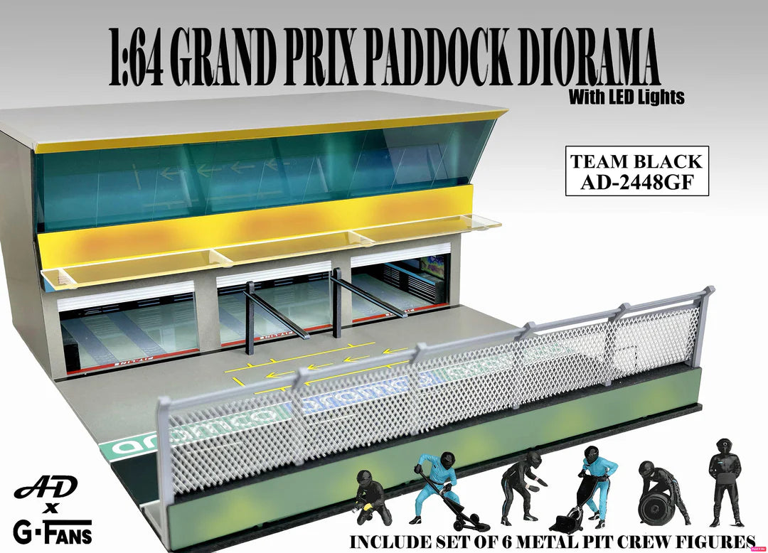 American Diorama Grand Prix Paddock Team Black 1:64 diorama with LED lighting, metal debris fence, and six pit crew figures.