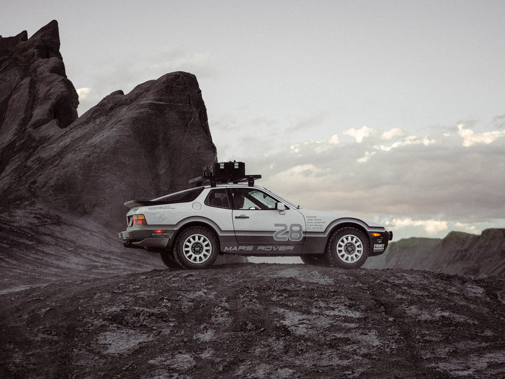 Limited edition Tarmac Works Porsche Mars Rover 944 x GRAMS #28 in grey.