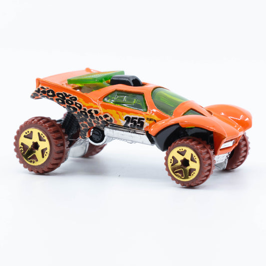 Hot Wheels Da’Kar off-road die-cast vehicle with raised suspension, rally graphics, and all-terrain tires. Front-Side
