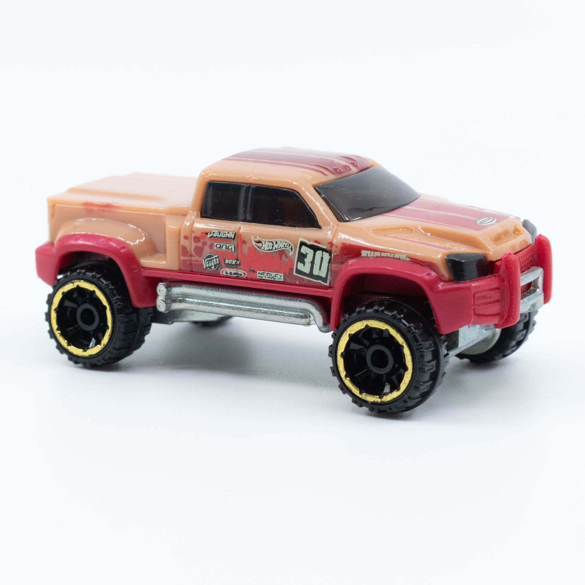 Hot Wheels Mega-Duty 1:64 diecast truck with lifted suspension and rugged utility styling. Front