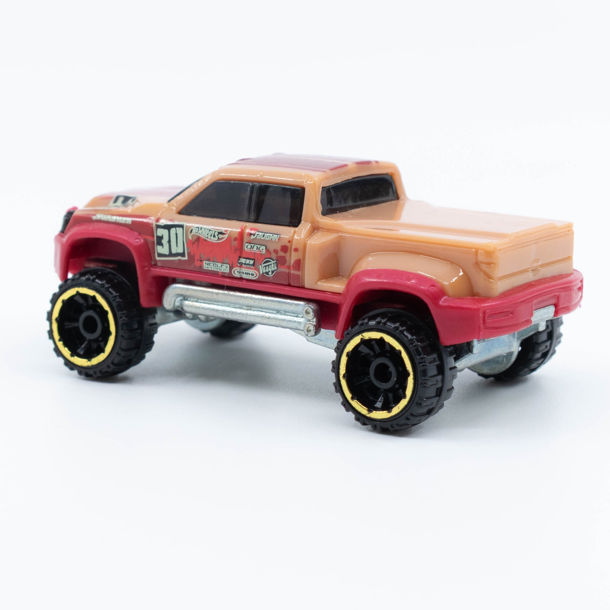 Hot Wheels Mega-Duty 1:64 diecast truck with lifted suspension and rugged utility styling. Back