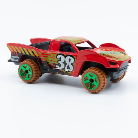 Hot Wheels Baja Truck in 1:64 scale with lifted suspension, roof rack, and off-road racing graphics. Front