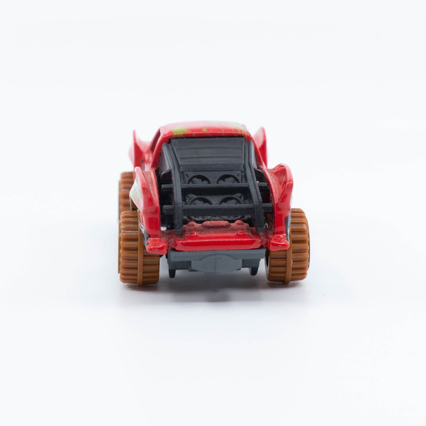 Hot Wheels Baja Truck in 1:64 scale with lifted suspension, roof rack, and off-road racing graphics. Back