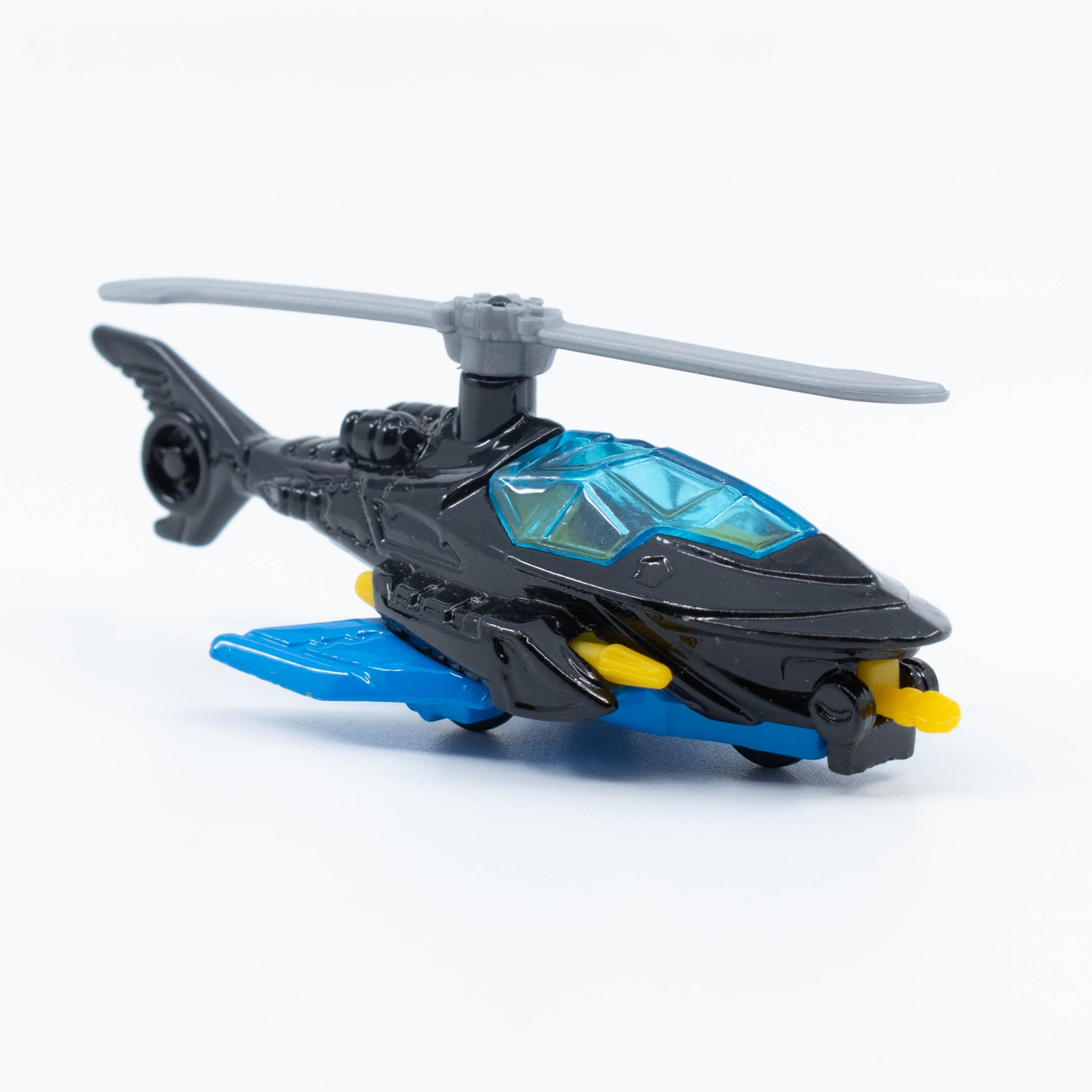 Hot Wheels Batcopter in 1:64 scale with black bat-wing design and spinning rotor blades. Front