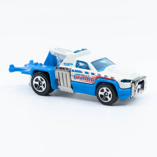 Hot Wheels Repo Duty tow truck with hook and utility bed in 1:64 scale. Front
