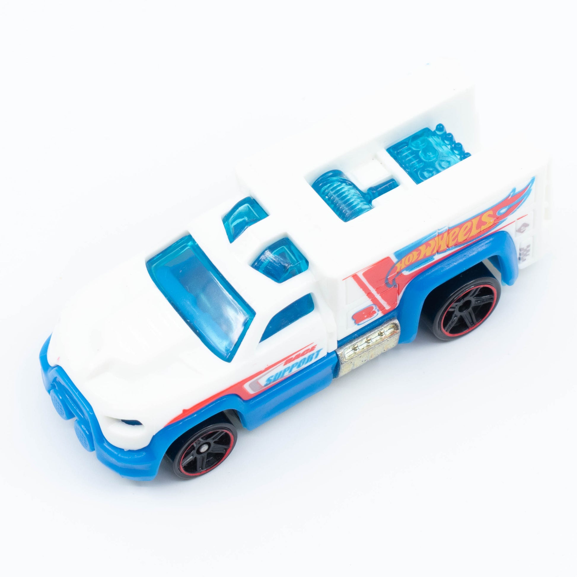 Hot Wheels Rescue Duty 1:64 scale emergency truck with light bar and white-and-blue rescue graphics. Top