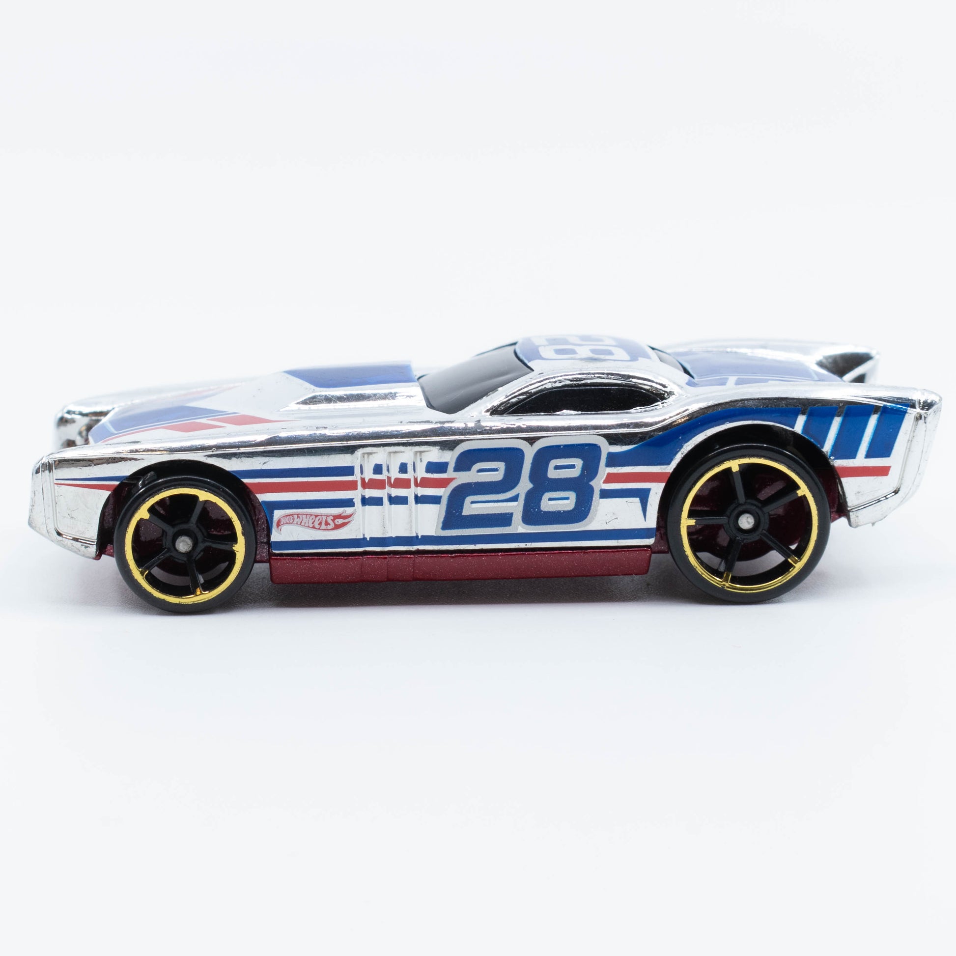 Hot Wheels The Gov’ner 1:64 scale diecast car with low-profile body and sporty chrome detailing. Side