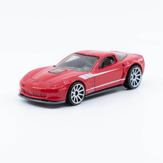 Hot Wheels diecast of the 2009 Corvette ZR1 with detailed body and clear hood showcasing engine. Front